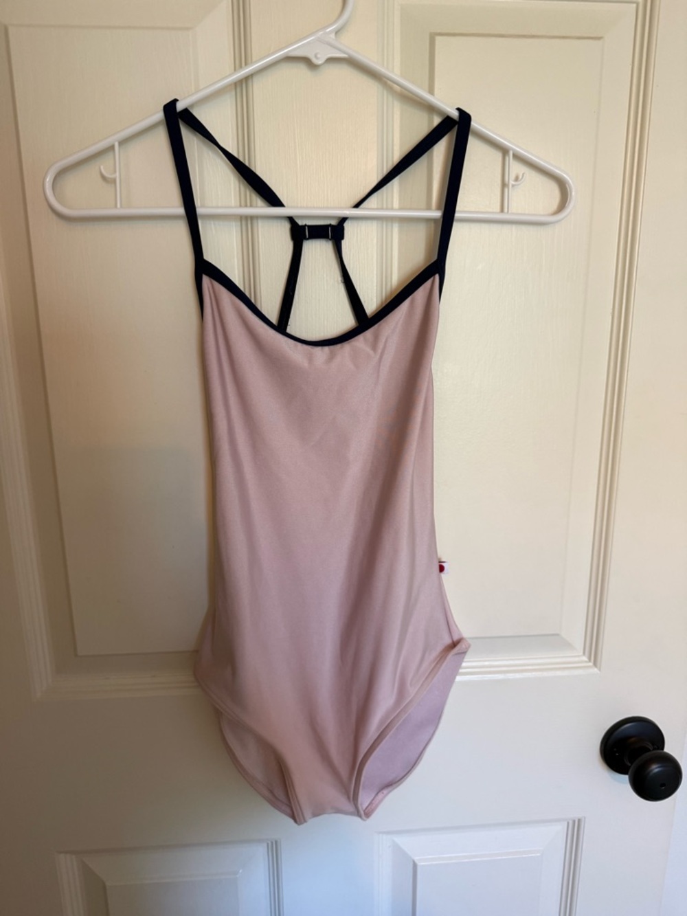 Yumiko Light Pink leotard with navy Trim